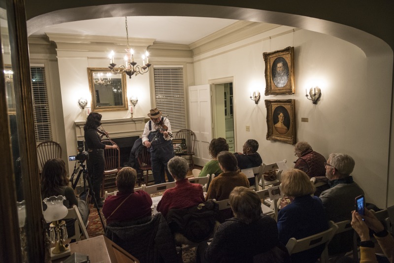 ["On the evening of Wednesday, January 16, 2019, The West Virginia Folklife Program hosted a showcase of their Folklife Apprenticeship Program, featuring master gospel and blues musician Doris Fields (aka Lady D) with apprentice Xavier Oglesby, and master old-time fiddler John D. Morris with apprentice Jen Iskow. The free event was held from 5:30-7:30pm at the historic MacFarland-Hubbard House, headquarters of the West Virginia Humanities Council (1310 Kanawha Blvd. E), in Charleston. The evening included musical performances by the two pairs and a question-answer session, followed by a reception.Doris Fields, who performs as Lady D, is known as West Virginias First Lady of Soul. A West Virginia native, she began singing in church choir as a child and has performed original and traditional blues, gospel, R&B, and soul across the state and country, including for the Obama for Change Inaugural Ball. Xavier Oglesby grew up singing in the black Pentecostal church and has performed in local a capella and theatre groups. He recently recorded voiceovers for the New River Gorge African American Heritage Auto Tour. Both Fields and Oglesby reside in Beckley.John D. Morris, of Ivydale, is an acclaimed West Virginia fiddler and tradition bearer who has been honored by the Augusta Heritage Center, the West Virginia Music Hall of Fame, the West Virginia Fiddler Award, and a National Heritage Fellowship for his role in sustaining the tradition. Jen Iskow, of Thomas, is a West Virginia University alumni, community organizer, artist, and designer at Beartown Design Studio. She has studied with numerous masters of Appalachian old-time fiddle.The West Virginia Folklife Apprenticeship Program offers a stipend to West Virginia master traditional artists or tradition bearers working with qualified apprentices on a year-long in-depth apprenticeship in their cultural expression or traditional art form. These apprenticeships aim to facilitate the transmission of techniques and artistry of the forms, as well as their histories and traditions. 2018 was the first year of the biennial Folklife Apprenticeship Program.Read more about the apprenticeship pairs on the West Virginia Folklife blog:https://wvfolklife.org/2018/12/03/2018-master-artist-apprentice-feature-doris-fields-aka-lady-d-xavier-oglesby-blues-black-gospel/https://wvfolklife.org/2018/11/09/2018-master-artist-apprentice-feature-john-morris-jen-iskow-old-time-fiddling-and-stories-of-clay-county/"]%