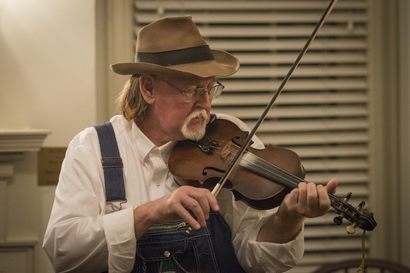 ["On the evening of Wednesday, January 16, 2019, The West Virginia Folklife Program hosted a showcase of their Folklife Apprenticeship Program, featuring master gospel and blues musician Doris Fields (aka Lady D) with apprentice Xavier Oglesby, and master old-time fiddler John D. Morris with apprentice Jen Iskow. The free event was held from 5:30-7:30pm at the historic MacFarland-Hubbard House, headquarters of the West Virginia Humanities Council (1310 Kanawha Blvd. E), in Charleston. The evening included musical performances by the two pairs and a question-answer session, followed by a reception.Doris Fields, who performs as Lady D, is known as West Virginias First Lady of Soul. A West Virginia native, she began singing in church choir as a child and has performed original and traditional blues, gospel, R&B, and soul across the state and country, including for the Obama for Change Inaugural Ball. Xavier Oglesby grew up singing in the black Pentecostal church and has performed in local a capella and theatre groups. He recently recorded voiceovers for the New River Gorge African American Heritage Auto Tour. Both Fields and Oglesby reside in Beckley.John D. Morris, of Ivydale, is an acclaimed West Virginia fiddler and tradition bearer who has been honored by the Augusta Heritage Center, the West Virginia Music Hall of Fame, the West Virginia Fiddler Award, and a National Heritage Fellowship for his role in sustaining the tradition. Jen Iskow, of Thomas, is a West Virginia University alumni, community organizer, artist, and designer at Beartown Design Studio. She has studied with numerous masters of Appalachian old-time fiddle.The West Virginia Folklife Apprenticeship Program offers a stipend to West Virginia master traditional artists or tradition bearers working with qualified apprentices on a year-long in-depth apprenticeship in their cultural expression or traditional art form. These apprenticeships aim to facilitate the transmission of techniques and artistry of the forms, as well as their histories and traditions. 2018 was the first year of the biennial Folklife Apprenticeship Program.Read more about the apprenticeship pairs on the West Virginia Folklife blog:https://wvfolklife.org/2018/12/03/2018-master-artist-apprentice-feature-doris-fields-aka-lady-d-xavier-oglesby-blues-black-gospel/https://wvfolklife.org/2018/11/09/2018-master-artist-apprentice-feature-john-morris-jen-iskow-old-time-fiddling-and-stories-of-clay-county/"]%