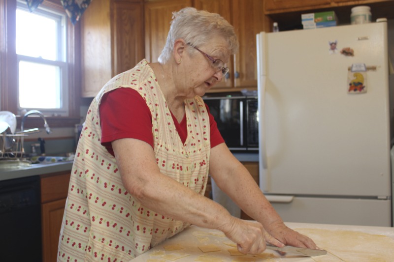 ["Eleanor Betler was born in Buckhannon, West Virginia in 1940 and raised in Cleveland, Ohio. She spent her summers in Helvetia at the farm of her maternal grandparents, James and Anna Merkli McNeal. She married Howard Bud Betler in 1961. The couple moved to a hilltop farm in Helvetia and raised four children. All the good cooks, many of them relatives of Mr. Betler taught Mrs. Betler about canning, preserving, cooking and baking. She was especially interested to learn the skills of butchering and preserving meat, and making sausage. Mrs. Betler loves the Swiss traditional baking but also Appalachian ways of some neighbors. She grinds her own flour for baking bread. At Fasnacht time she invites neighbors and friends to make the hozablatz and rosettes just to keep the tradition alive. She also preserves this history by collecting stories, music, and photographs for The Helvetia Archives.This interview is part of a series of interviews conducted with foodways practitioners in Helvetia, West Virginia, as part of the Helvetia Foodways Oral History Project in partnership with the Southern Foodways Alliance. Learn more: https://www.southernfoodways.org/oral-history/helvetia-west-virginia/"]%