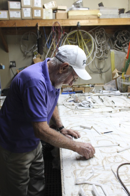 ["James L. Day (July 5, 1932-April 12, 2019) was the owner of JL Day Sign Company in St. Albans, WV. He made hand-bent neon signs for nearly 60 years and was one of the last hand tube benders in the Kanawha Valley.In 2018, the West Virginia Folklife Program worked with West Virginia Public Broadcasting to produce audio and video documentaries about Day. View them at https://wvfolklife.org/2018/09/04/st-albans-artisan-has-been-making-neon-signs-by-hand-for-five-decades-a-profile-of-james-l-day/Video: https://www.youtube.com/watch?v=cCe99a7ke50&feature=emb_titleAudio: https://soundcloud.com/wvpublicnews/wva-artisan-has-been-making-neon-signs-by-hand-for-five-decadesRead Days obituary here: https://www.dignitymemorial.com/obituaries/saint-albans-wv/james-day-8250954"]%