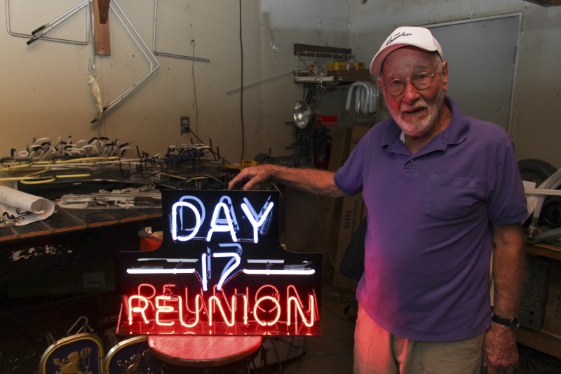 ["James L. Day (July 5, 1932-April 12, 2019) was the owner of JL Day Sign Company in St. Albans, WV. He made hand-bent neon signs for nearly 60 years and was one of the last hand tube benders in the Kanawha Valley.In 2018, the West Virginia Folklife Program worked with West Virginia Public Broadcasting to produce audio and video documentaries about Day. View them at https://wvfolklife.org/2018/09/04/st-albans-artisan-has-been-making-neon-signs-by-hand-for-five-decades-a-profile-of-james-l-day/Video: https://www.youtube.com/watch?v=cCe99a7ke50&feature=emb_titleAudio: https://soundcloud.com/wvpublicnews/wva-artisan-has-been-making-neon-signs-by-hand-for-five-decadesRead Days obituary here: https://www.dignitymemorial.com/obituaries/saint-albans-wv/james-day-8250954"]%