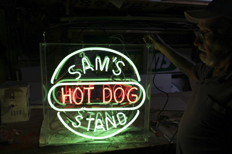 ["James L. Day (July 5, 1932-April 12, 2019) was the owner of JL Day Sign Company in St. Albans, WV. He made hand-bent neon signs for nearly 60 years and was one of the last hand tube benders in the Kanawha Valley.In 2018, the West Virginia Folklife Program worked with West Virginia Public Broadcasting to produce audio and video documentaries about Day. View them at https://wvfolklife.org/2018/09/04/st-albans-artisan-has-been-making-neon-signs-by-hand-for-five-decades-a-profile-of-james-l-day/Video: https://www.youtube.com/watch?v=cCe99a7ke50&feature=emb_titleAudio: https://soundcloud.com/wvpublicnews/wva-artisan-has-been-making-neon-signs-by-hand-for-five-decadesRead Days obituary here: https://www.dignitymemorial.com/obituaries/saint-albans-wv/james-day-8250954"]%