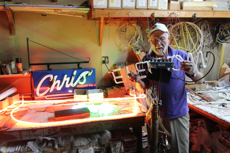 James L. Day (July 5, 1932-April 12, 2019) was the owner of JL Day Sign Company in St. Albans, WV. He made hand-bent neon signs for nearly 60 years and was one of the last hand tube benders in the Kanawha Valley.In 2018, the West Virginia Folklife Program worked with West Virginia Public Broadcasting to produce audio and video documentaries about Day. View them at https://wvfolklife.org/2018/09/04/st-albans-artisan-has-been-making-neon-signs-by-hand-for-five-decades-a-profile-of-james-l-day/Video: https://www.youtube.com/watch?v=cCe99a7ke50&feature=emb_titleAudio: https://soundcloud.com/wvpublicnews/wva-artisan-has-been-making-neon-signs-by-hand-for-five-decadesRead Days obituary here: https://www.dignitymemorial.com/obituaries/saint-albans-wv/james-day-8250954