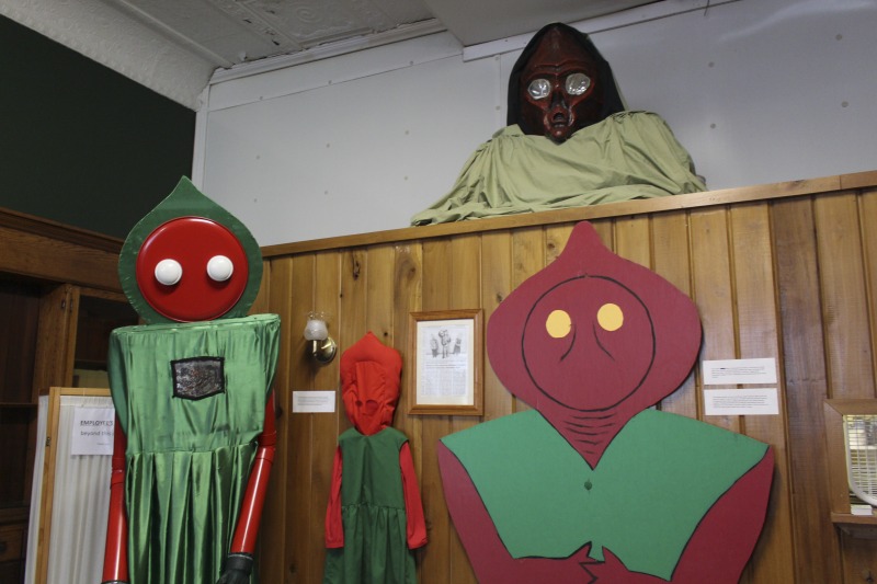 ["The Flatwoods Monster Museum, which also serves as the Braxton County Visitors Center, is located in downtown Sutton in Braxton County, West Virginia. The Museum displays ephemera, folk art, videos, and souvenirs related to the legend of the Flatwoods Monster, which was first sighted in Flatwoods, West Virginia on September 12, 1952 by Kathleen May, Eugene Lemon, Teddy May, Ronald Shaver, Neal Nunley, Teddy Neal, and Tommy Hyer. West Virginia Humanities Council Executive Director Eric Waggoner and State Folklorist Emily Hilliard visited the museum and met with Andrew Smith, Executive Director of the Braxton County CVB and Flatwoods Monster Museum, on January 30, 2020.Visit the Flatwoods Museum website here: https://braxtonwv.org/the-flatwoods-monster/visit-the-museum/For more on the legend of the Flatwoods Monster, visit e-WV: https://www.wvencyclopedia.org/articles/2192"]%