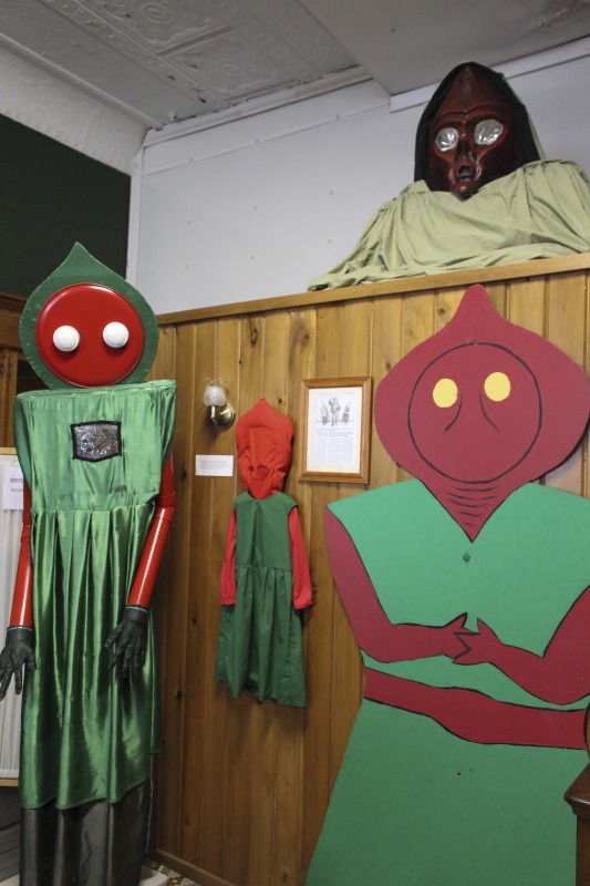 ["The Flatwoods Monster Museum, which also serves as the Braxton County Visitors Center, is located in downtown Sutton in Braxton County, West Virginia. The Museum displays ephemera, folk art, videos, and souvenirs related to the legend of the Flatwoods Monster, which was first sighted in Flatwoods, West Virginia on September 12, 1952 by Kathleen May, Eugene Lemon, Teddy May, Ronald Shaver, Neal Nunley, Teddy Neal, and Tommy Hyer. West Virginia Humanities Council Executive Director Eric Waggoner and State Folklorist Emily Hilliard visited the museum and met with Andrew Smith, Executive Director of the Braxton County CVB and Flatwoods Monster Museum, on January 30, 2020.Visit the Flatwoods Museum website here: https://braxtonwv.org/the-flatwoods-monster/visit-the-museum/For more on the legend of the Flatwoods Monster, visit e-WV: https://www.wvencyclopedia.org/articles/2192"]%