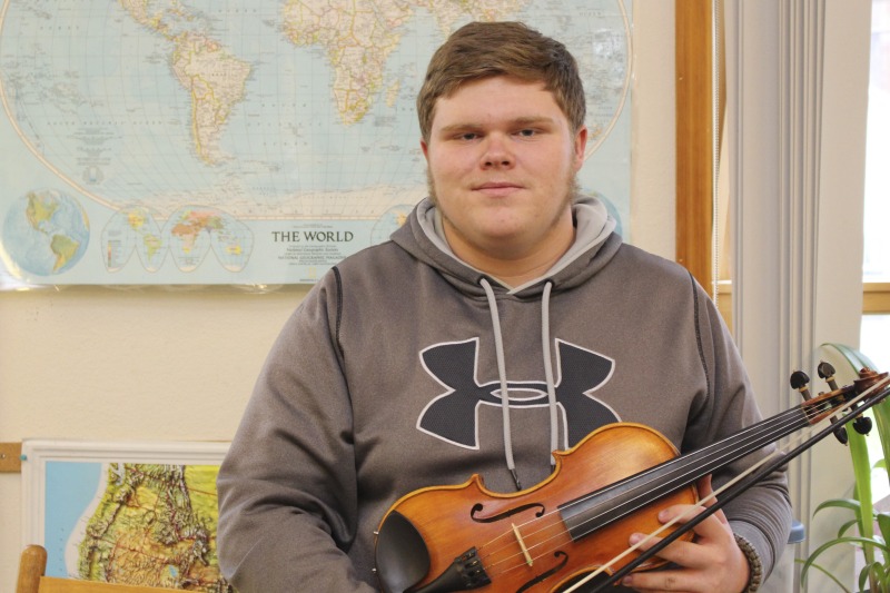 ["Trevor Hammons is a 17-year old banjo player and fiddler from Pocahontas County, and a member of the legendary musical Hammons Family. He is the only member of the Hammons Family who still actively plays music in the familys old-time tradition."]%