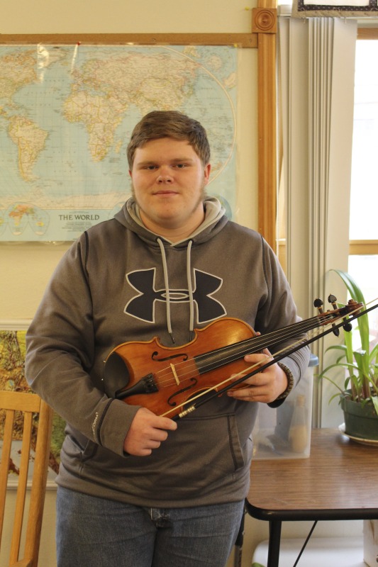 ["Trevor Hammons is a 17-year old banjo player and fiddler from Pocahontas County, and a member of the legendary musical Hammons Family. He is the only member of the Hammons Family who still actively plays music in the familys old-time tradition."]%