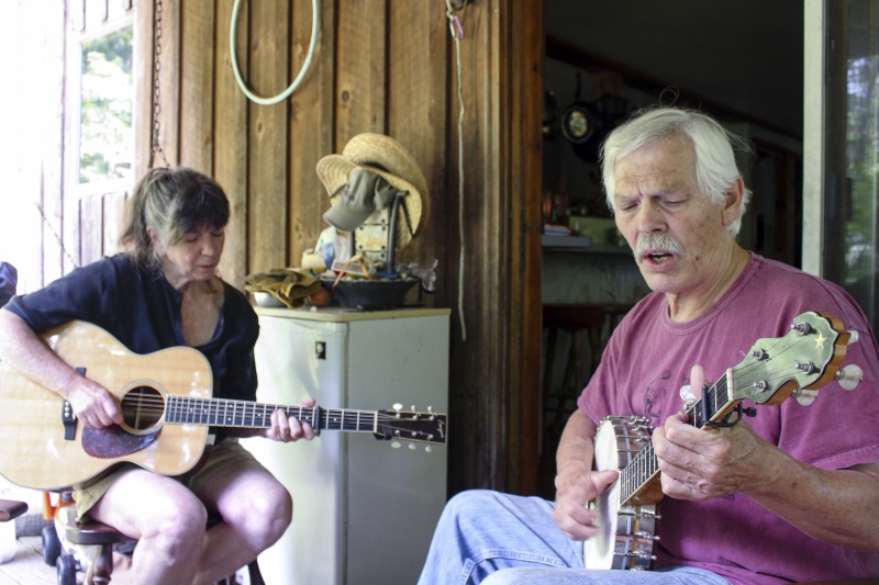 Sam & Joe HerrmannJoe Herrmann (b.1949) and Sam Herrmann (b. 1949), both Maryland natives, are traditional musicians who play together as part of Critton Hollow String Band. They have been a couple since the mid-1970s when they moved to Hampshire County, West Virginia. Joe is a fiddle and banjo player, and Sam is a guitar and hammer dulcimer player. Sam is also a knitter, hand yarn spinner, and owns the knitting kit company Samspun. They live on a piece of land in Paw Paw, WV where they keep sheep.