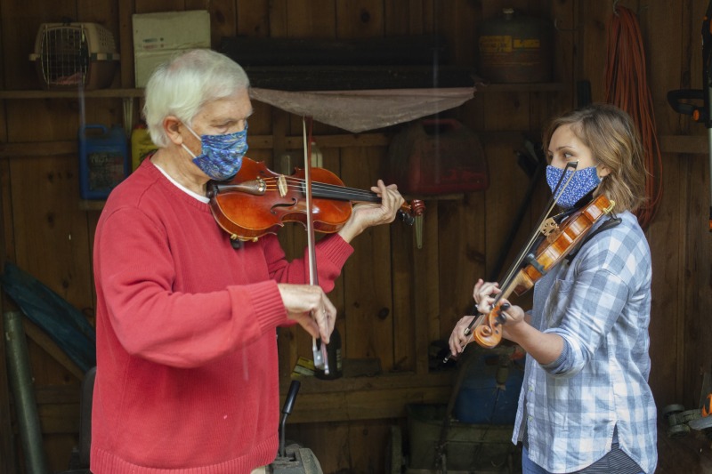 ["Joe Herrman (master artist, b. 1949)  of Paw Paw in Hampshire County and Dakota Karper (apprentice, b. 1992) of Capon Bridge are participants in the 2020-2021 West Virginia Folklife Apprenticeship Program, studying old-time fiddle. Herrmann is a founding member of the Critton Hollow String Band and has taught old-time fiddle to many private students and at the Augusta Heritage Center. Dakota Karper, a Hampshire County native, has been playing old-time fiddle for 20 years and runs The Cat and the Fiddle Music School. Herrmann and Karper apprenticed together previously in 2004 (when Karper was 11) through Augusta Heritage Centers former Apprenticeship Program.See the West Virginia Folklife Program feature on Herrmann and Karper: https://wvfolklife.org/2020/12/03/2020-folklife-apprenticeship-feature-joe-herrmann-dakota-karper-old-time-fiddle/"]%