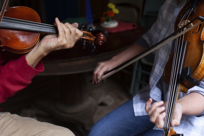 ["Joe Herrman (master artist, b. 1949)  of Paw Paw in Hampshire County and Dakota Karper (apprentice, b. 1992) of Capon Bridge are participants in the 2020-2021 West Virginia Folklife Apprenticeship Program, studying old-time fiddle. Herrmann is a founding member of the Critton Hollow String Band and has taught old-time fiddle to many private students and at the Augusta Heritage Center. Dakota Karper, a Hampshire County native, has been playing old-time fiddle for 20 years and runs The Cat and the Fiddle Music School. Herrmann and Karper apprenticed together previously in 2004 (when Karper was 11) through Augusta Heritage Centers former Apprenticeship Program.See the West Virginia Folklife Program feature on Herrmann and Karper: https://wvfolklife.org/2020/12/03/2020-folklife-apprenticeship-feature-joe-herrmann-dakota-karper-old-time-fiddle/"]%