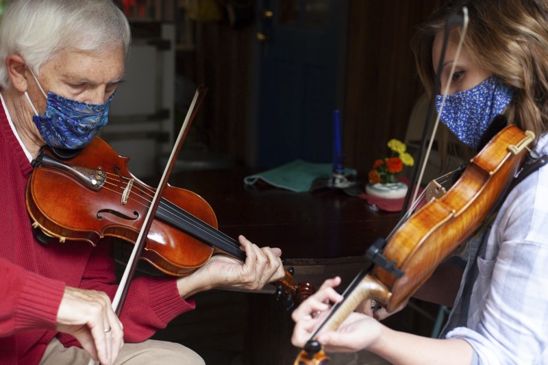 ["Joe Herrman (master artist, b. 1949)  of Paw Paw in Hampshire County and Dakota Karper (apprentice, b. 1992) of Capon Bridge are participants in the 2020-2021 West Virginia Folklife Apprenticeship Program, studying old-time fiddle. Herrmann is a founding member of the Critton Hollow String Band and has taught old-time fiddle to many private students and at the Augusta Heritage Center. Dakota Karper, a Hampshire County native, has been playing old-time fiddle for 20 years and runs The Cat and the Fiddle Music School. Herrmann and Karper apprenticed together previously in 2004 (when Karper was 11) through Augusta Heritage Centers former Apprenticeship Program.See the West Virginia Folklife Program feature on Herrmann and Karper: https://wvfolklife.org/2020/12/03/2020-folklife-apprenticeship-feature-joe-herrmann-dakota-karper-old-time-fiddle/"]%