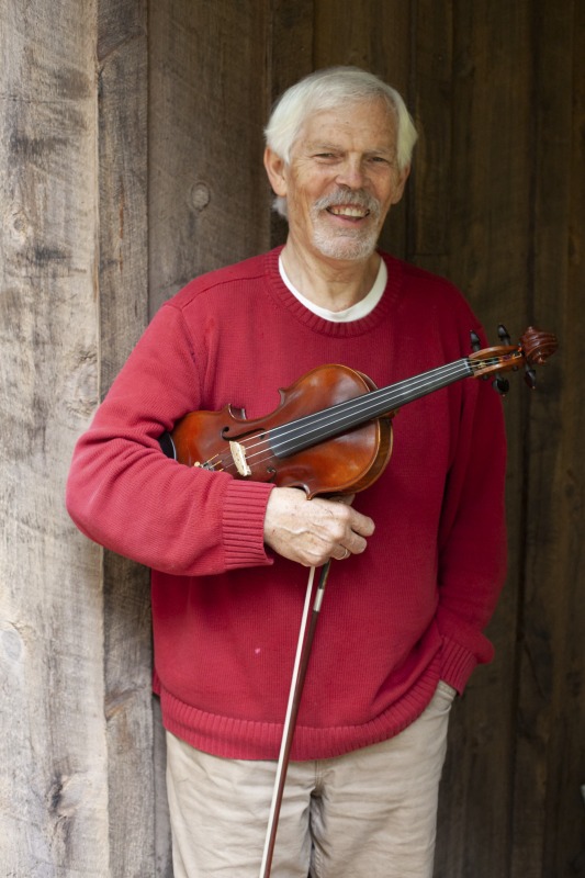 ["Joe Herrman (master artist, b. 1949)  of Paw Paw in Hampshire County and Dakota Karper (apprentice, b. 1992) of Capon Bridge are participants in the 2020-2021 West Virginia Folklife Apprenticeship Program, studying old-time fiddle. Herrmann is a founding member of the Critton Hollow String Band and has taught old-time fiddle to many private students and at the Augusta Heritage Center. Dakota Karper, a Hampshire County native, has been playing old-time fiddle for 20 years and runs The Cat and the Fiddle Music School. Herrmann and Karper apprenticed together previously in 2004 (when Karper was 11) through Augusta Heritage Centers former Apprenticeship Program.See the West Virginia Folklife Program feature on Herrmann and Karper: https://wvfolklife.org/2020/12/03/2020-folklife-apprenticeship-feature-joe-herrmann-dakota-karper-old-time-fiddle/"]%