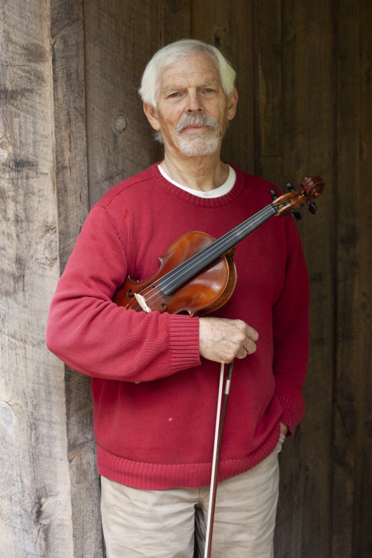 ["Joe Herrman (master artist, b. 1949)  of Paw Paw in Hampshire County and Dakota Karper (apprentice, b. 1992) of Capon Bridge are participants in the 2020-2021 West Virginia Folklife Apprenticeship Program, studying old-time fiddle. Herrmann is a founding member of the Critton Hollow String Band and has taught old-time fiddle to many private students and at the Augusta Heritage Center. Dakota Karper, a Hampshire County native, has been playing old-time fiddle for 20 years and runs The Cat and the Fiddle Music School. Herrmann and Karper apprenticed together previously in 2004 (when Karper was 11) through Augusta Heritage Centers former Apprenticeship Program.See the West Virginia Folklife Program feature on Herrmann and Karper: https://wvfolklife.org/2020/12/03/2020-folklife-apprenticeship-feature-joe-herrmann-dakota-karper-old-time-fiddle/"]%