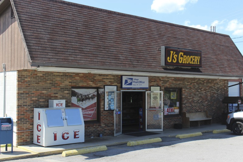 ["J's Grocery is a convenience store and deli in Kegley, WV, owned by Marie and Junior Burrell. J's also serves as the village post office. Though J's no longer serves food, Marie used to serve hot dogs, pizza, hand-pattied hamburgers, and homemade buttermilk biscuits out of the store.This is part of a collection of materials documenting West Virginia hot dogs and hot dog joints. For more, see the West Virginia hot dog blog: http://wvhotdogblog.blogspot.com/ and Emily Hilliard's piece, \"Slaw Abiding Citizens: A Quest for the West Virginia Hot Dog\" published in the Southern Foodways Alliance's journal Gravy. https://www.southernfoodways.org/slaw-abiding-citizens-a-quest-for-the-west-virginia-hot-dog/"]%