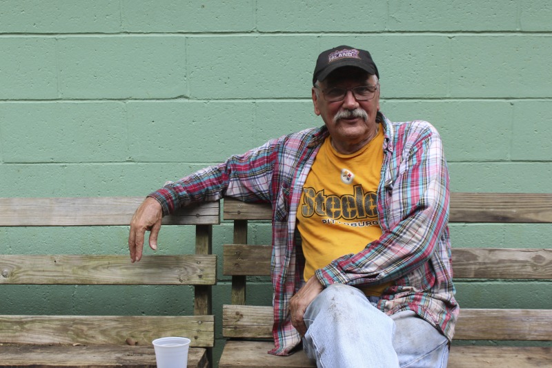 ["John Kosanovich is a Weirton native and retired Weirton Steel worker of Serbian descent. He is a member of the Steubenville, OH Serbian Holy Resurrection Serbian Church and Mens Club and is one of the old-timers who manages the Mens Club Chicken Blasts at the Weirton Serbian Picnic Grounds every Wednesday in the summer. See the short video and audio documentary about the Chicken Blasts, produced by the West Virginia Folklife Program and West Virginia Public Broadcasting: https://wvfolklife.org/2020/01/27/weirtons-serbian-heritage-is-a-chicken-blast/https://www.youtube.com/watch?v=XpGF-MFUlhYhttps://soundcloud.com/wvpublicnews/weirtons-serbian-heritage-is-a-chicken-blast"]%