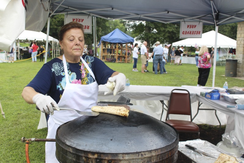 ["Wheelings Our Lady of Lebanon Maronite Catholic Church has been hosting its annual Mahrajan Festival at Oglebay Park for over 85 years. The festival began in 1933 as a fundraiser to rebuild the church, which had been lost to fire the year prior. Activities at the Mahrajan festival include a vast spread of Lebanese food--including kibbee, tabbouli, stuffed grape leaves, hummus, saj bread, and various Lebanese cookies and desserts, a sale of handcrafted Lebanese items, live music, Lebanese dancing, and a liturgy.To learn more about Our Lady of Lebanon Maronite Catholic Church, visit their website: http://www.ololwv.com/Also see interviews with church elders Carol Dougherty and Nick Ghaphery in the West Virginia Folklife Collection. The Dougherty interview is excerpted here: https://wvfolklife.org/2017/02/23/field-notes-carol-dougherty/"]%