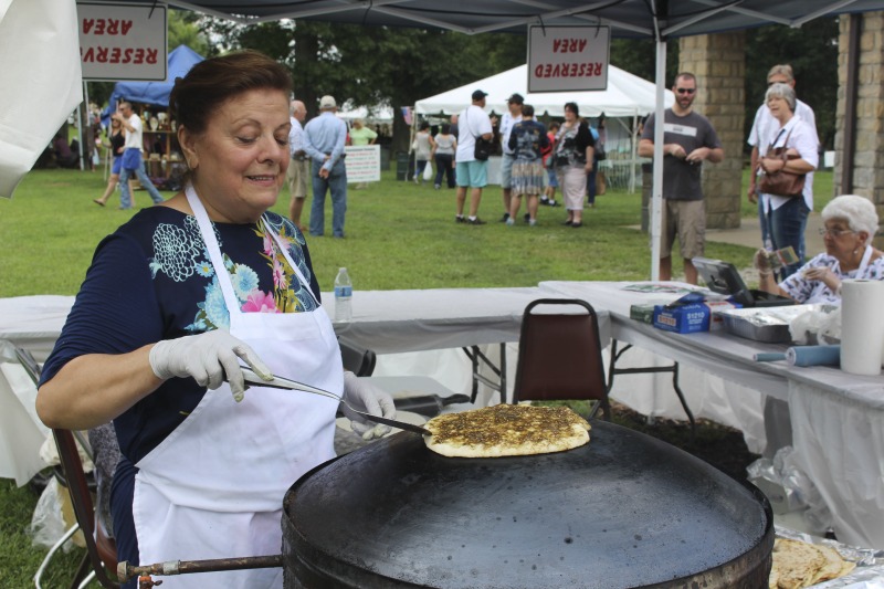 Wheelings Our Lady of Lebanon Maronite Catholic Church has been hosting its annual Mahrajan Festival at Oglebay Park for over 85 years. The festival began in 1933 as a fundraiser to rebuild the church, which had been lost to fire the year prior. Activities at the Mahrajan festival include a vast spread of Lebanese food--including kibbee, tabbouli, stuffed grape leaves, hummus, saj bread, and various Lebanese cookies and desserts, a sale of handcrafted Lebanese items, live music, Lebanese dancing, and a liturgy.To learn more about Our Lady of Lebanon Maronite Catholic Church, visit their website: http://www.ololwv.com/Also see interviews with church elders Carol Dougherty and Nick Ghaphery in the West Virginia Folklife Collection. The Dougherty interview is excerpted here: https://wvfolklife.org/2017/02/23/field-notes-carol-dougherty/