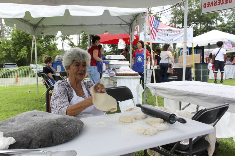 ["Wheelings Our Lady of Lebanon Maronite Catholic Church has been hosting its annual Mahrajan Festival at Oglebay Park for over 85 years. The festival began in 1933 as a fundraiser to rebuild the church, which had been lost to fire the year prior. Activities at the Mahrajan festival include a vast spread of Lebanese food--including kibbee, tabbouli, stuffed grape leaves, hummus, saj bread, and various Lebanese cookies and desserts, a sale of handcrafted Lebanese items, live music, Lebanese dancing, and a liturgy.To learn more about Our Lady of Lebanon Maronite Catholic Church, visit their website: http://www.ololwv.com/Also see interviews with church elders Carol Dougherty and Nick Ghaphery in the West Virginia Folklife Collection. The Dougherty interview is excerpted here: https://wvfolklife.org/2017/02/23/field-notes-carol-dougherty/"]%