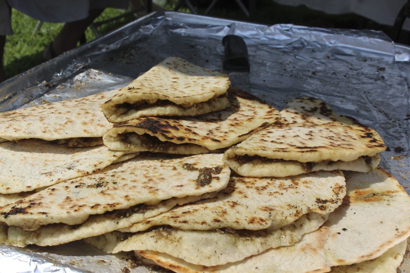 Wheelings Our Lady of Lebanon Maronite Catholic Church has been hosting its annual Mahrajan Festival at Oglebay Park for over 85 years. The festival began in 1933 as a fundraiser to rebuild the church, which had been lost to fire the year prior. Activities at the Mahrajan festival include a vast spread of Lebanese food--including kibbee, tabbouli, stuffed grape leaves, hummus, saj bread, and various Lebanese cookies and desserts, a sale of handcrafted Lebanese items, live music, Lebanese dancing, and a liturgy.To learn more about Our Lady of Lebanon Maronite Catholic Church, visit their website: http://www.ololwv.com/Also see interviews with church elders Carol Dougherty and Nick Ghaphery in the West Virginia Folklife Collection. The Dougherty interview is excerpted here: https://wvfolklife.org/2017/02/23/field-notes-carol-dougherty/