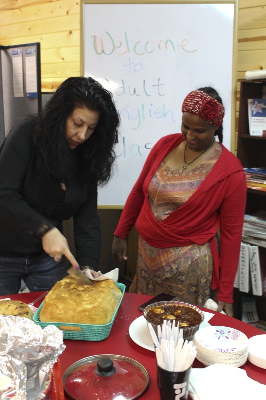 ["On February 25, 2020, Amy Loughs (b. 1975, Murray, Kentucky) Hardy County ESOL class in Moorefield hosted an Ethiopian/Eritrean coffee ceremony and potluck. Students, who are of Haitian, Burmese, Eritrean, Ethiopian, and Puerto Rican dissent brought in food dishes from their respective cultural traditions, to share with the class and state folklorist Emily Hilliard. The majority of the ESOL students work at Pilgrims Pride chicken plant in Moorefield. Dishes students brought to class include Mohinga, a Burmese soup with chili; a Burmese tea leaf salad; and Yuzana, a Burmese pickled tea; Ethiopian Doro Wat; Puerto Rican bread pudding; Haitian fried pork with gratin; and Himbasha, an Ethiopian bread with black sesame seeds or black cumin."]%