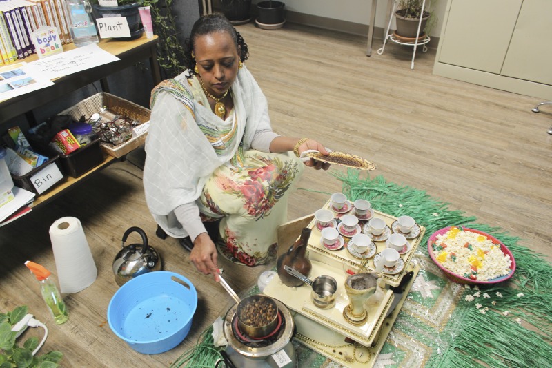 On February 25, 2020, Amy Loughs (b. 1975, Murray, Kentucky) Hardy County ESOL class in Moorefield hosted an Ethiopian/Eritrean coffee ceremony and potluck. Students, who are of Haitian, Burmese, Eritrean, Ethiopian, and Puerto Rican dissent brought in food dishes from their respective cultural traditions, to share with the class and state folklorist Emily Hilliard. The majority of the ESOL students work at Pilgrims Pride chicken plant in Moorefield. Dishes students brought to class include Mohinga, a Burmese soup with chili; a Burmese tea leaf salad; and Yuzana, a Burmese pickled tea; Ethiopian Doro Wat; Puerto Rican bread pudding; Haitian fried pork with gratin; and Himbasha, an Ethiopian bread with black sesame seeds or black cumin.