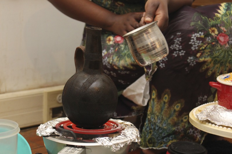 ["These photos were taken of a traditional Eritrean/Ethiopian coffee ceremony hosted by Trihas and her family at their home in Moorefield, West Virginia on June 26, 2021. Trihas and her family are immigrants from Eritrea and work at Pilgrims Pride chicken plant in Moorefield. Trihas friends and coworkers, Azeb and Kelem, who are Ethiopian immigrants, as well as Hardy County ESOL teacher Amy Lough were also guests at the ceremony. Inside Appalachia Folkways producer Clara Haizlett and West Virginia state folklorist Emily Hilliard are working on a radio piece about the coffee ceremony for West Virginia Public Broadcasting."]%