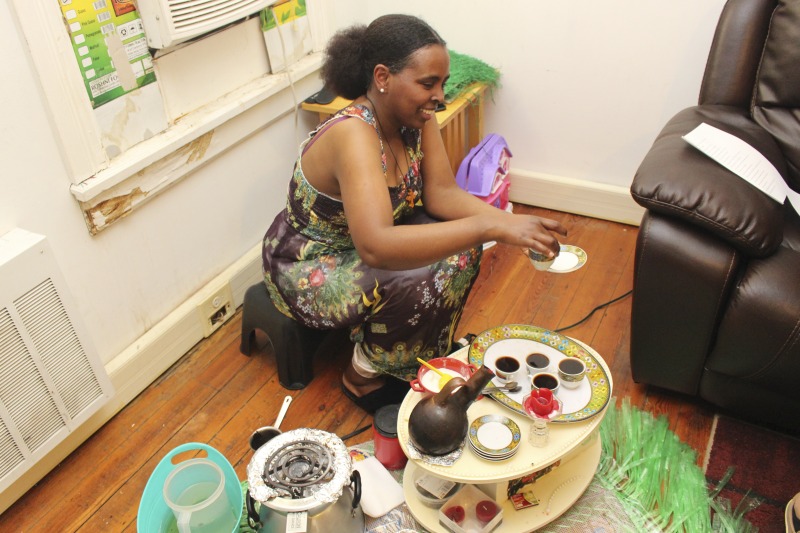 These photos were taken of a traditional Eritrean/Ethiopian coffee ceremony hosted by Trihas and her family at their home in Moorefield, West Virginia on June 26, 2021. Trihas and her family are immigrants from Eritrea and work at Pilgrims Pride chicken plant in Moorefield. Trihas friends and coworkers, Azeb and Kelem, who are Ethiopian immigrants, as well as Hardy County ESOL teacher Amy Lough were also guests at the ceremony. Inside Appalachia Folkways producer Clara Haizlett and West Virginia state folklorist Emily Hilliard are working on a radio piece about the coffee ceremony for West Virginia Public Broadcasting.