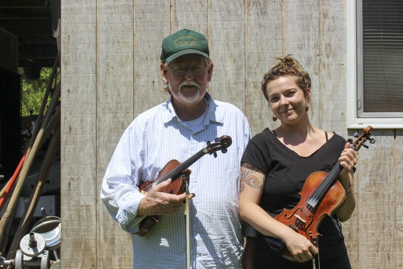 ["John D. Morris of Ivydale led an apprenticeship in old-time fiddle and stories of Clay County with Jen Iskow of Thomas as part of the 2018 West Virginia Folklife Apprenticeship Program, supported in part by the National Endowment for the Arts. John D. MorrisBorn in Ivydale, Clay County, into a family steeped in traditional music, David and John Morris learned from family and neighbors, including banjo player Jenes Cottrell and fiddler French Carpenter. After David returned from Vietnam in 1968, the brothers began organizing musical get-togethers and, in 1969, held the first Morris Family Old-Time Music Festival that same year. The festival became a major traditional music event in Clay County and filmmaker Bob Gates documented the 1972 festival in his film The Morris Family Old-Time Music Festival.Members of The Morris Brothers band included Pocahontas County old-time banjo player Dwight Diller and the late North Carolina harmonica player John Martin. Playing a mix of old-time, bluegrass, and country styles, including some of Davids original music, the group played together through the mid-70s, releasing an LP in the late 60s, Music As We Learned It, and two live shows on eight-track tapes. John, a traditional fiddler, and David, a singer, songwriter, and guitarist, were involved in union and environmental activities from the late 1960s through the 1970s. They were also instrumental in establishing the first Vandalia Gathering at the Cultural Center in 1977.The Morris Brothers music was featured in Barbara Kopples 1976 film Harlan County, USA. David, who passed away in 2016, contributed music to Kopples 2015 film about Vietnam vets, Shelter.John lives in Ivydale and plays fiddle at music events across West Virginia. He is a rich source of information about the history of old-time music in central West Virginia, and one of the few native fiddlers of his generation to continue the older style of playing.Morris was awarded the National Endowment for the Arts National Heritage Fellowship, the nations highest honor in the folk and traditional arts, in 2020.Jen IskowJen Iskow is an artist, designer, musician, and community organizer based in Thomas, West Virginia. Born and raised in Rockville, Maryland, Jen grew up learning to play blues and punk music. It wasnt until she moved to Morgantown in 2009 for college that she was introduced to old-time music at the weekly Brew Pub jam hosted by Stewed Mulligan. After graduating from West Virginia University, she finally settled in Elkins, West Virginia and accepted a position as the Marketing Coordinator for the Augusta Heritage Center. Suddenly being surrounded by so many talented traditional artists, Jen was immersed into the music and inspired to learn to play fiddle. After studying under talented fiddlers such as Scott Prouty, Erynn Marshall, Jesse Wells, Ben Townsend, John Harrod, and more, Jen met John Morris at his house in Ivydale, and the rest is historySee our feature on Morris apprenticeship with Iskow here: https://wvfolklife.org/2018/11/09/2018-master-artist-apprentice-feature-john-morris-jen-iskow-old-time-fiddling-and-stories-of-clay-county/"]%