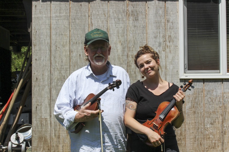 John D. Morris of Ivydale led an apprenticeship in old-time fiddle and stories of Clay County with Jen Iskow of Thomas as part of the 2018 West Virginia Folklife Apprenticeship Program, supported in part by the National Endowment for the Arts. John D. MorrisBorn in Ivydale, Clay County, into a family steeped in traditional music, David and John Morris learned from family and neighbors, including banjo player Jenes Cottrell and fiddler French Carpenter. After David returned from Vietnam in 1968, the brothers began organizing musical get-togethers and, in 1969, held the first Morris Family Old-Time Music Festival that same year. The festival became a major traditional music event in Clay County and filmmaker Bob Gates documented the 1972 festival in his film The Morris Family Old-Time Music Festival.Members of The Morris Brothers band included Pocahontas County old-time banjo player Dwight Diller and the late North Carolina harmonica player John Martin. Playing a mix of old-time, bluegrass, and country styles, including some of Davids original music, the group played together through the mid-70s, releasing an LP in the late 60s, Music As We Learned It, and two live shows on eight-track tapes. John, a traditional fiddler, and David, a singer, songwriter, and guitarist, were involved in union and environmental activities from the late 1960s through the 1970s. They were also instrumental in establishing the first Vandalia Gathering at the Cultural Center in 1977.The Morris Brothers music was featured in Barbara Kopples 1976 film Harlan County, USA. David, who passed away in 2016, contributed music to Kopples 2015 film about Vietnam vets, Shelter.John lives in Ivydale and plays fiddle at music events across West Virginia. He is a rich source of information about the history of old-time music in central West Virginia, and one of the few native fiddlers of his generation to continue the older style of playing.Morris was awarded the National Endowment for the Arts National Heritage Fellowship, the nations highest honor in the folk and traditional arts, in 2020.Jen IskowJen Iskow is an artist, designer, musician, and community organizer based in Thomas, West Virginia. Born and raised in Rockville, Maryland, Jen grew up learning to play blues and punk music. It wasnt until she moved to Morgantown in 2009 for college that she was introduced to old-time music at the weekly Brew Pub jam hosted by Stewed Mulligan. After graduating from West Virginia University, she finally settled in Elkins, West Virginia and accepted a position as the Marketing Coordinator for the Augusta Heritage Center. Suddenly being surrounded by so many talented traditional artists, Jen was immersed into the music and inspired to learn to play fiddle. After studying under talented fiddlers such as Scott Prouty, Erynn Marshall, Jesse Wells, Ben Townsend, John Harrod, and more, Jen met John Morris at his house in Ivydale, and the rest is historySee our feature on Morris apprenticeship with Iskow here: https://wvfolklife.org/2018/11/09/2018-master-artist-apprentice-feature-john-morris-jen-iskow-old-time-fiddling-and-stories-of-clay-county/