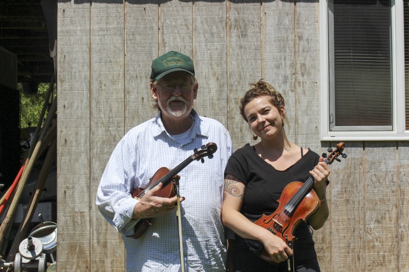 ["John D. Morris of Ivydale led an apprenticeship in old-time fiddle and stories of Clay County with Jen Iskow of Thomas as part of the 2018 West Virginia Folklife Apprenticeship Program, supported in part by the National Endowment for the Arts. John D. MorrisBorn in Ivydale, Clay County, into a family steeped in traditional music, David and John Morris learned from family and neighbors, including banjo player Jenes Cottrell and fiddler French Carpenter. After David returned from Vietnam in 1968, the brothers began organizing musical get-togethers and, in 1969, held the first Morris Family Old-Time Music Festival that same year. The festival became a major traditional music event in Clay County and filmmaker Bob Gates documented the 1972 festival in his film The Morris Family Old-Time Music Festival.Members of The Morris Brothers band included Pocahontas County old-time banjo player Dwight Diller and the late North Carolina harmonica player John Martin. Playing a mix of old-time, bluegrass, and country styles, including some of Davids original music, the group played together through the mid-70s, releasing an LP in the late 60s, Music As We Learned It, and two live shows on eight-track tapes. John, a traditional fiddler, and David, a singer, songwriter, and guitarist, were involved in union and environmental activities from the late 1960s through the 1970s. They were also instrumental in establishing the first Vandalia Gathering at the Cultural Center in 1977.The Morris Brothers music was featured in Barbara Kopples 1976 film Harlan County, USA. David, who passed away in 2016, contributed music to Kopples 2015 film about Vietnam vets, Shelter.John lives in Ivydale and plays fiddle at music events across West Virginia. He is a rich source of information about the history of old-time music in central West Virginia, and one of the few native fiddlers of his generation to continue the older style of playing.Morris was awarded the National Endowment for the Arts National Heritage Fellowship, the nations highest honor in the folk and traditional arts, in 2020.Jen IskowJen Iskow is an artist, designer, musician, and community organizer based in Thomas, West Virginia. Born and raised in Rockville, Maryland, Jen grew up learning to play blues and punk music. It wasnt until she moved to Morgantown in 2009 for college that she was introduced to old-time music at the weekly Brew Pub jam hosted by Stewed Mulligan. After graduating from West Virginia University, she finally settled in Elkins, West Virginia and accepted a position as the Marketing Coordinator for the Augusta Heritage Center. Suddenly being surrounded by so many talented traditional artists, Jen was immersed into the music and inspired to learn to play fiddle. After studying under talented fiddlers such as Scott Prouty, Erynn Marshall, Jesse Wells, Ben Townsend, John Harrod, and more, Jen met John Morris at his house in Ivydale, and the rest is historySee our feature on Morris apprenticeship with Iskow here: https://wvfolklife.org/2018/11/09/2018-master-artist-apprentice-feature-john-morris-jen-iskow-old-time-fiddling-and-stories-of-clay-county/"]%