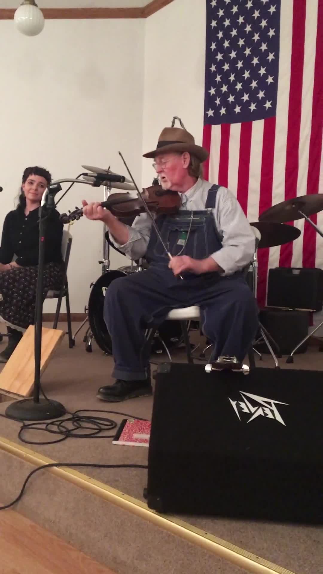 ["John D. Morris of Ivydale led an apprenticeship in old-time fiddle and stories of Clay County with Jen Iskow of Thomas as part of the 2018 West Virginia Folklife Apprenticeship Program, supported in part by the National Endowment for the Arts. John D. MorrisBorn in Ivydale, Clay County, into a family steeped in traditional music, David and John Morris learned from family and neighbors, including banjo player Jenes Cottrell and fiddler French Carpenter. After David returned from Vietnam in 1968, the brothers began organizing musical get-togethers and, in 1969, held the first Morris Family Old-Time Music Festival that same year. The festival became a major traditional music event in Clay County and filmmaker Bob Gates documented the 1972 festival in his film The Morris Family Old-Time Music Festival.Members of The Morris Brothers band included Pocahontas County old-time banjo player Dwight Diller and the late North Carolina harmonica player John Martin. Playing a mix of old-time, bluegrass, and country styles, including some of Davids original music, the group played together through the mid-70s, releasing an LP in the late 60s, Music As We Learned It, and two live shows on eight-track tapes. John, a traditional fiddler, and David, a singer, songwriter, and guitarist, were involved in union and environmental activities from the late 1960s through the 1970s. They were also instrumental in establishing the first Vandalia Gathering at the Cultural Center in 1977.The Morris Brothers music was featured in Barbara Kopples 1976 film Harlan County, USA. David, who passed away in 2016, contributed music to Kopples 2015 film about Vietnam vets, Shelter.John lives in Ivydale and plays fiddle at music events across West Virginia. He is a rich source of information about the history of old-time music in central West Virginia, and one of the few native fiddlers of his generation to continue the older style of playing.Morris was awarded the National Endowment for the Arts National Heritage Fellowship, the nations highest honor in the folk and traditional arts, in 2020.Jen IskowJen Iskow is an artist, designer, musician, and community organizer based in Thomas, West Virginia. Born and raised in Rockville, Maryland, Jen grew up learning to play blues and punk music. It wasnt until she moved to Morgantown in 2009 for college that she was introduced to old-time music at the weekly Brew Pub jam hosted by Stewed Mulligan. After graduating from West Virginia University, she finally settled in Elkins, West Virginia and accepted a position as the Marketing Coordinator for the Augusta Heritage Center. Suddenly being surrounded by so many talented traditional artists, Jen was immersed into the music and inspired to learn to play fiddle. After studying under talented fiddlers such as Scott Prouty, Erynn Marshall, Jesse Wells, Ben Townsend, John Harrod, and more, Jen met John Morris at his house in Ivydale, and the rest is historySee our feature on Morris apprenticeship with Iskow here: https://wvfolklife.org/2018/11/09/2018-master-artist-apprentice-feature-john-morris-jen-iskow-old-time-fiddling-and-stories-of-clay-county/"]%