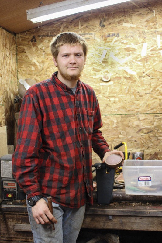 ["Aaron Parsons, 20 years old at the time of this photo, is a native of Jackson County, WV. He makes turkey calls with materials (slate, native woods, bone, etc.) found on his familys land in Jackson County. He is also a hunter, trapper, fisher, and hide tanner."]%