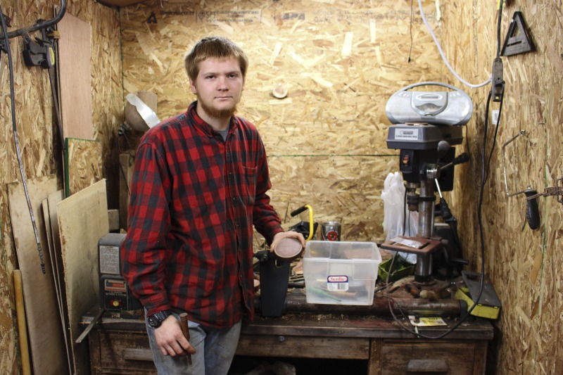 ["Aaron Parsons, 20 years old at the time of this photo, is a native of Jackson County, WV. He makes turkey calls with materials (slate, native woods, bone, etc.) found on his familys land in Jackson County. He is also a hunter, trapper, fisher, and hide tanner."]%