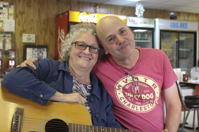 ["Elaine (Moore) Purkey is an activist songwriter and musician from Harts Creek, West Virginia in Lincoln County. She was born on May 29, 1949, on the same piece of property where she still lives. She was raised in a family of musicians and flatfoot dancers and attributes her powerful voice to the acapella singing she learned as a member of the Church of Christ. As a teenager she played in bands with her brother, and in early adulthood she was the lead singer of a local country band. In the 1980s, she began performing regularly on the Wallace Horn Friendly Neighbors Show, a live radio program out of Logan County that has been on the air since 1967. She now hosts the show."]%