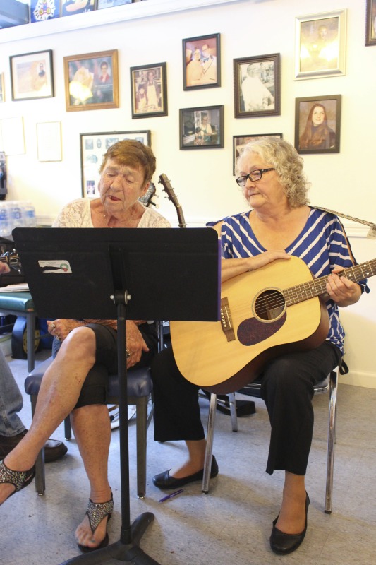 Elaine (Moore) Purkey is an activist songwriter and musician from Harts Creek, West Virginia in Lincoln County. She was born on May 29, 1949, on the same piece of property where she still lives. She was raised in a family of musicians and flatfoot dancers and attributes her powerful voice to the acapella singing she learned as a member of the Church of Christ. As a teenager she played in bands with her brother, and in early adulthood she was the lead singer of a local country band. In the 1980s, she began performing regularly on the Wallace Horn Friendly Neighbors Show, a live radio program out of Logan County that has been on the air since 1967. She now hosts the show. Elaine performed a concert at Yasou Greek Restaurant in McDowell County on July 8, 2017. The concert was sponsored by the West Virginia Folklife Program at the West Virginia Humanities Council and McArts.