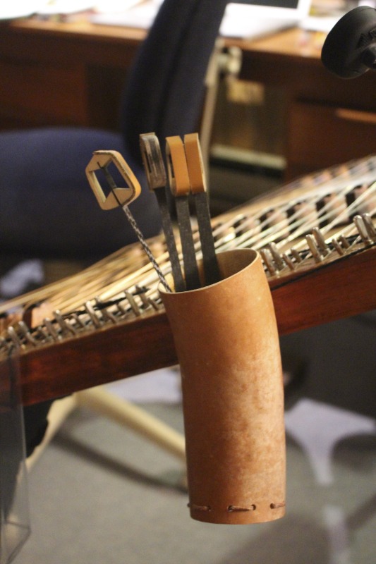 ["Hammer dulcimer hammers made by Sam Rizzetta. Rizzetta is a dulcimer designer, builder, and musician who moved to West Virginia in the early 1970s. He was a member of the string band Trapezoid and founded the hammer dulcimer playing classes at the Augusta Heritage Center at Davis & Elkins College. He has built dulcimers for musicians including John McCutcheon, Guy Carawan, and Sam Herrmann. Rizzetta now collaborates with the Dusty Strings Company who build hammer dulcimers based on his designs. He lives with his wife Carrie Rizzetta in Berkeley County, WV. He was photographed in his home workshop."]%