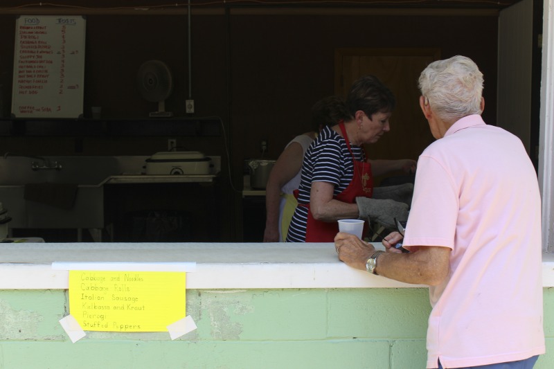 ["Every July, the Mens Club of the Steubenville, Ohio Holy Resurrection Serbian Orthodox Church hosts an annual picnic at their picnic grounds along Kings Creek in Weirton, West Virginia. The event serves as both a fundraiser for the Mens Club and a homecoming for Weirton and Steubenvilles Serbian Community. The event features Serbian music, dance, food, and drink. Mens Club members roast chickens and lambs on spits over open wood fires and sell them to picnic attendees. The spits were constructed out of material from Weirton Steel by Mens Club members and Weirton Steel employees in the 1960s. Other food served at the picnic includes pogacha (a type of Serbian bread), haluski or cabbage and noodles, cevaps (a pork, lamb, and beef sausage), strudel, nut rolls, beer, and Slivovitz.In 2017, state folklorist Emily Hilliard attended the Serbian picnic with Brynn Kusic, whose fathers family is part of the Weirton Serbian community. In 2019, Hilliard attended with a WVPB film crew to capture additional video footage and audio tape for a short video documentary (see below).Learn more about the Annual Picnic via the Holy Resurrection Serbian Orthodox Church: https://www.hrsoc-steubenville.org/annual-picnicSee the short video and audio documentary about the Chicken Blasts, produced by the West Virginia Folklife Program and West Virginia Public Broadcasting: https://wvfolklife.org/2020/01/27/weirtons-serbian-heritage-is-a-chicken-blast/ https://www.youtube.com/watch?v=XpGF-MFUlhYhttps://soundcloud.com/wvpublicnews/weirtons-serbian-heritage-is-a-chicken-blast"]%