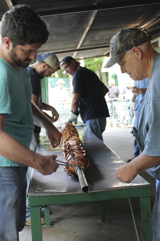 ["Every July, the Mens Club of the Steubenville, Ohio Holy Resurrection Serbian Orthodox Church hosts an annual picnic at their picnic grounds along Kings Creek in Weirton, West Virginia. The event serves as both a fundraiser for the Mens Club and a homecoming for Weirton and Steubenvilles Serbian Community. The event features Serbian music, dance, food, and drink. Mens Club members roast chickens and lambs on spits over open wood fires and sell them to picnic attendees. The spits were constructed out of material from Weirton Steel by Mens Club members and Weirton Steel employees in the 1960s. Other food served at the picnic includes pogacha (a type of Serbian bread), haluski or cabbage and noodles, cevaps (a pork, lamb, and beef sausage), strudel, nut rolls, beer, and Slivovitz.In 2017, state folklorist Emily Hilliard attended the Serbian picnic with Brynn Kusic, whose fathers family is part of the Weirton Serbian community. In 2019, Hilliard attended with a WVPB film crew to capture additional video footage and audio tape for a short video documentary (see below).Learn more about the Annual Picnic via the Holy Resurrection Serbian Orthodox Church: https://www.hrsoc-steubenville.org/annual-picnicSee the short video and audio documentary about the Chicken Blasts, produced by the West Virginia Folklife Program and West Virginia Public Broadcasting: https://wvfolklife.org/2020/01/27/weirtons-serbian-heritage-is-a-chicken-blast/ https://www.youtube.com/watch?v=XpGF-MFUlhYhttps://soundcloud.com/wvpublicnews/weirtons-serbian-heritage-is-a-chicken-blast"]%