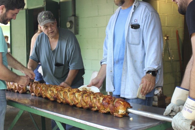 ["Every July, the Mens Club of the Steubenville, Ohio Holy Resurrection Serbian Orthodox Church hosts an annual picnic at their picnic grounds along Kings Creek in Weirton, West Virginia. The event serves as both a fundraiser for the Mens Club and a homecoming for Weirton and Steubenvilles Serbian Community. The event features Serbian music, dance, food, and drink. Mens Club members roast chickens and lambs on spits over open wood fires and sell them to picnic attendees. The spits were constructed out of material from Weirton Steel by Mens Club members and Weirton Steel employees in the 1960s. Other food served at the picnic includes pogacha (a type of Serbian bread), haluski or cabbage and noodles, cevaps (a pork, lamb, and beef sausage), strudel, nut rolls, beer, and Slivovitz.In 2017, state folklorist Emily Hilliard attended the Serbian picnic with Brynn Kusic, whose fathers family is part of the Weirton Serbian community. In 2019, Hilliard attended with a WVPB film crew to capture additional video footage and audio tape for a short video documentary (see below).Learn more about the Annual Picnic via the Holy Resurrection Serbian Orthodox Church: https://www.hrsoc-steubenville.org/annual-picnicSee the short video and audio documentary about the Chicken Blasts, produced by the West Virginia Folklife Program and West Virginia Public Broadcasting: https://wvfolklife.org/2020/01/27/weirtons-serbian-heritage-is-a-chicken-blast/ https://www.youtube.com/watch?v=XpGF-MFUlhYhttps://soundcloud.com/wvpublicnews/weirtons-serbian-heritage-is-a-chicken-blast"]%