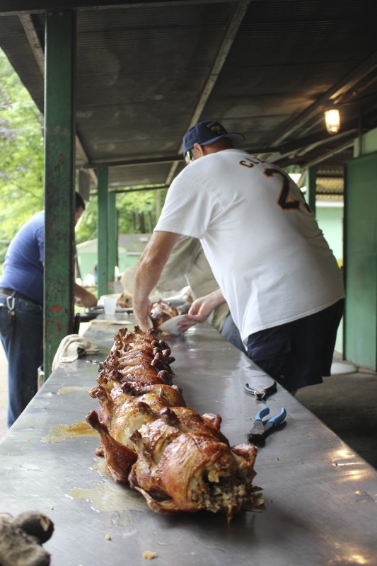 Every July, the Mens Club of the Steubenville, Ohio Holy Resurrection Serbian Orthodox Church hosts an annual picnic at their picnic grounds along Kings Creek in Weirton, West Virginia. The event serves as both a fundraiser for the Mens Club and a homecoming for Weirton and Steubenvilles Serbian Community. The event features Serbian music, dance, food, and drink. Mens Club members roast chickens and lambs on spits over open wood fires and sell them to picnic attendees. The spits were constructed out of material from Weirton Steel by Mens Club members and Weirton Steel employees in the 1960s. Other food served at the picnic includes pogacha (a type of Serbian bread), haluski or cabbage and noodles, cevaps (a pork, lamb, and beef sausage), strudel, nut rolls, beer, and Slivovitz.In 2017, state folklorist Emily Hilliard attended the Serbian picnic with Brynn Kusic, whose fathers family is part of the Weirton Serbian community. Learn more about the Annual Picnic via the Holy Resurrection Serbian Orthodox Church: https://www.hrsoc-steubenville.org/annual-picnicSee the short video and audio documentary about the Chicken Blasts, produced by the West Virginia Folklife Program and West Virginia Public Broadcasting: https://wvfolklife.org/2020/01/27/weirtons-serbian-heritage-is-a-chicken-blast/ https://www.youtube.com/watch?v=XpGF-MFUlhYhttps://soundcloud.com/wvpublicnews/weirtons-serbian-heritage-is-a-chicken-blast