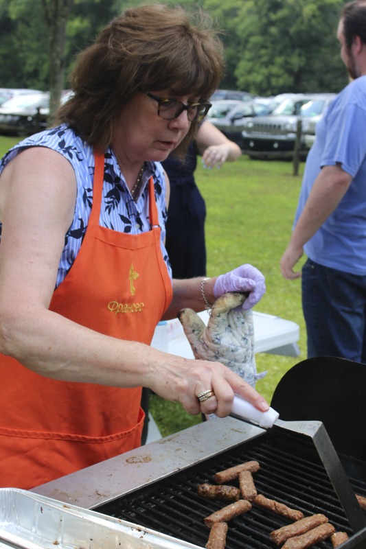 ["Every July, the Mens Club of the Steubenville, Ohio Holy Resurrection Serbian Orthodox Church hosts an annual picnic at their picnic grounds along Kings Creek in Weirton, West Virginia. The event serves as both a fundraiser for the Mens Club and a homecoming for Weirton and Steubenvilles Serbian Community. The event features Serbian music, dance, food, and drink. Mens Club members roast chickens and lambs on spits over open wood fires and sell them to picnic attendees. The spits were constructed out of material from Weirton Steel by Mens Club members and Weirton Steel employees in the 1960s. Other food served at the picnic includes pogacha (a type of Serbian bread), haluski or cabbage and noodles, cevaps (a pork, lamb, and beef sausage), strudel, nut rolls, beer, and Slivovitz.In 2017, state folklorist Emily Hilliard attended the Serbian picnic with Brynn Kusic, whose fathers family is part of the Weirton Serbian community. In 2019, Hilliard attended with a WVPB film crew to capture additional video footage and audio tape for a short video documentary (see below).Learn more about the Annual Picnic via the Holy Resurrection Serbian Orthodox Church: https://www.hrsoc-steubenville.org/annual-picnicSee the short video and audio documentary about the Chicken Blasts, produced by the West Virginia Folklife Program and West Virginia Public Broadcasting: https://wvfolklife.org/2020/01/27/weirtons-serbian-heritage-is-a-chicken-blast/ https://www.youtube.com/watch?v=XpGF-MFUlhYhttps://soundcloud.com/wvpublicnews/weirtons-serbian-heritage-is-a-chicken-blast"]%