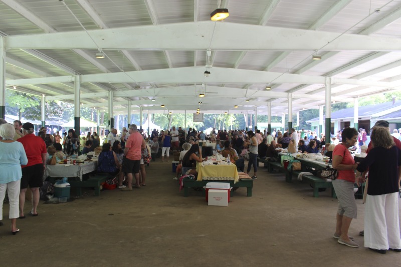 Every July, the Mens Club of the Steubenville, Ohio Holy Resurrection Serbian Orthodox Church hosts an annual picnic at their picnic grounds along Kings Creek in Weirton, West Virginia. The event serves as both a fundraiser for the Mens Club and a homecoming for Weirton and Steubenvilles Serbian Community. The event features Serbian music, dance, food, and drink. Mens Club members roast chickens and lambs on spits over open wood fires and sell them to picnic attendees. The spits were constructed out of material from Weirton Steel by Mens Club members and Weirton Steel employees in the 1960s. Other food served at the picnic includes pogacha (a type of Serbian bread), haluski or cabbage and noodles, cevaps (a pork, lamb, and beef sausage), strudel, nut rolls, beer, and Slivovitz.In 2017, state folklorist Emily Hilliard attended the Serbian picnic with Brynn Kusic, whose fathers family is part of the Weirton Serbian community. Learn more about the Annual Picnic via the Holy Resurrection Serbian Orthodox Church: https://www.hrsoc-steubenville.org/annual-picnicSee the short video and audio documentary about the Chicken Blasts, produced by the West Virginia Folklife Program and West Virginia Public Broadcasting: https://wvfolklife.org/2020/01/27/weirtons-serbian-heritage-is-a-chicken-blast/https://www.youtube.com/watch?v=XpGF-MFUlhYhttps://soundcloud.com/wvpublicnews/weirtons-serbian-heritage-is-a-chicken-blast