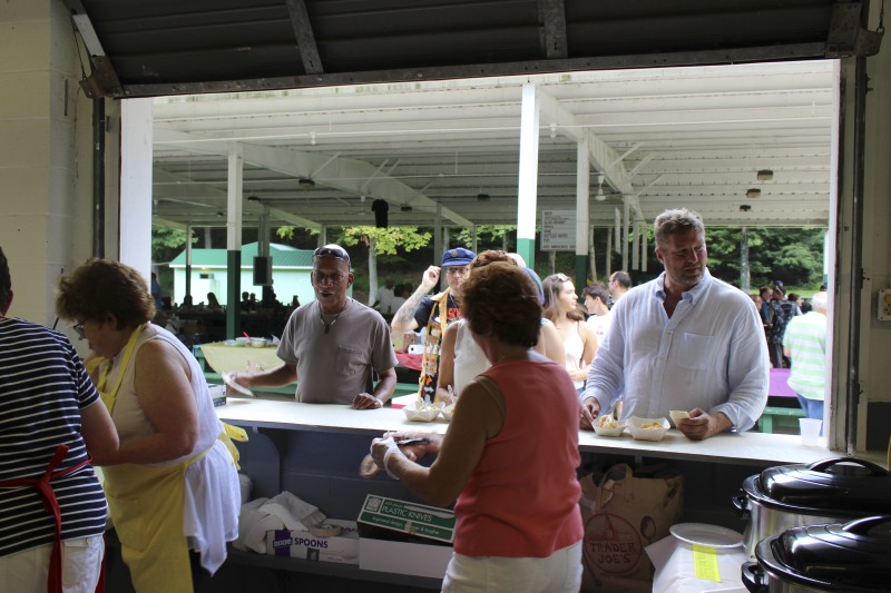 ["Every July, the Mens Club of the Steubenville, Ohio Holy Resurrection Serbian Orthodox Church hosts an annual picnic at their picnic grounds along Kings Creek in Weirton, West Virginia. The event serves as both a fundraiser for the Mens Club and a homecoming for Weirton and Steubenvilles Serbian Community. The event features Serbian music, dance, food, and drink. Mens Club members roast chickens and lambs on spits over open wood fires and sell them to picnic attendees. The spits were constructed out of material from Weirton Steel by Mens Club members and Weirton Steel employees in the 1960s. Other food served at the picnic includes pogacha (a type of Serbian bread), haluski or cabbage and noodles, cevaps (a pork, lamb, and beef sausage), strudel, nut rolls, beer, and Slivovitz.In 2017, state folklorist Emily Hilliard attended the Serbian picnic with Brynn Kusic, whose fathers family is part of the Weirton Serbian community. In 2019, Hilliard attended with a WVPB film crew to capture additional video footage and audio tape for a short video documentary (see below).Learn more about the Annual Picnic via the Holy Resurrection Serbian Orthodox Church: https://www.hrsoc-steubenville.org/annual-picnicSee the short video and audio documentary about the Chicken Blasts, produced by the West Virginia Folklife Program and West Virginia Public Broadcasting: https://wvfolklife.org/2020/01/27/weirtons-serbian-heritage-is-a-chicken-blast/ https://www.youtube.com/watch?v=XpGF-MFUlhYhttps://soundcloud.com/wvpublicnews/weirtons-serbian-heritage-is-a-chicken-blast"]%