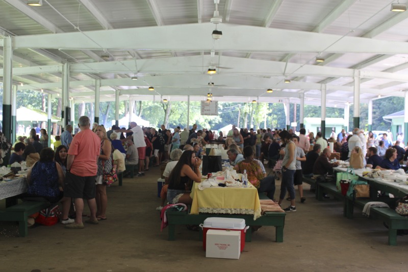 ["Every July, the Mens Club of the Steubenville, Ohio Holy Resurrection Serbian Orthodox Church hosts an annual picnic at their picnic grounds along Kings Creek in Weirton, West Virginia. The event serves as both a fundraiser for the Mens Club and a homecoming for Weirton and Steubenvilles Serbian Community. The event features Serbian music, dance, food, and drink. Mens Club members roast chickens and lambs on spits over open wood fires and sell them to picnic attendees. The spits were constructed out of material from Weirton Steel by Mens Club members and Weirton Steel employees in the 1960s. Other food served at the picnic includes pogacha (a type of Serbian bread), haluski or cabbage and noodles, cevaps (a pork, lamb, and beef sausage), strudel, nut rolls, beer, and Slivovitz.In 2017, state folklorist Emily Hilliard attended the Serbian picnic with Brynn Kusic, whose fathers family is part of the Weirton Serbian community. Learn more about the Annual Picnic via the Holy Resurrection Serbian Orthodox Church: https://www.hrsoc-steubenville.org/annual-picnicSee the short video and audio documentary about the Chicken Blasts, produced by the West Virginia Folklife Program and West Virginia Public Broadcasting: https://wvfolklife.org/2020/01/27/weirtons-serbian-heritage-is-a-chicken-blast/https://www.youtube.com/watch?v=XpGF-MFUlhYhttps://soundcloud.com/wvpublicnews/weirtons-serbian-heritage-is-a-chicken-blast"]%