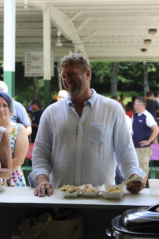 ["Every July, the Mens Club of the Steubenville, Ohio Holy Resurrection Serbian Orthodox Church hosts an annual picnic at their picnic grounds along Kings Creek in Weirton, West Virginia. The event serves as both a fundraiser for the Mens Club and a homecoming for Weirton and Steubenvilles Serbian Community. The event features Serbian music, dance, food, and drink. Mens Club members roast chickens and lambs on spits over open wood fires and sell them to picnic attendees. The spits were constructed out of material from Weirton Steel by Mens Club members and Weirton Steel employees in the 1960s. Other food served at the picnic includes pogacha (a type of Serbian bread), haluski or cabbage and noodles, cevaps (a pork, lamb, and beef sausage), strudel, nut rolls, beer, and Slivovitz.In 2017, state folklorist Emily Hilliard attended the Serbian picnic with Brynn Kusic, whose fathers family is part of the Weirton Serbian community. In 2019, Hilliard attended with a WVPB film crew to capture additional video footage and audio tape for a short video documentary (see below).Learn more about the Annual Picnic via the Holy Resurrection Serbian Orthodox Church: https://www.hrsoc-steubenville.org/annual-picnicSee the short video and audio documentary about the Chicken Blasts, produced by the West Virginia Folklife Program and West Virginia Public Broadcasting: https://wvfolklife.org/2020/01/27/weirtons-serbian-heritage-is-a-chicken-blast/ https://www.youtube.com/watch?v=XpGF-MFUlhYhttps://soundcloud.com/wvpublicnews/weirtons-serbian-heritage-is-a-chicken-blast"]%