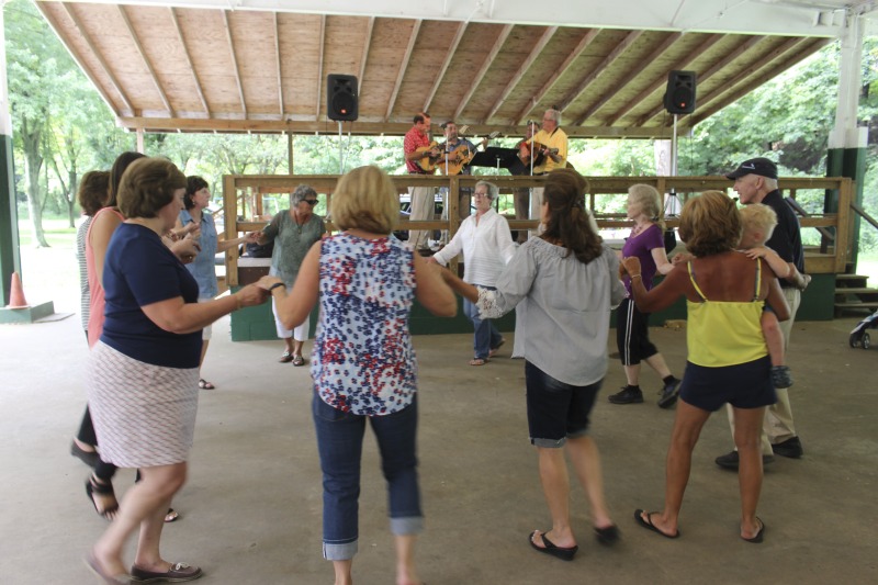 ["Every July, the Mens Club of the Steubenville, Ohio Holy Resurrection Serbian Orthodox Church hosts an annual picnic at their picnic grounds along Kings Creek in Weirton, West Virginia. The event serves as both a fundraiser for the Mens Club and a homecoming for Weirton and Steubenvilles Serbian Community. The event features Serbian music, dance, food, and drink. Mens Club members roast chickens and lambs on spits over open wood fires and sell them to picnic attendees. The spits were constructed out of material from Weirton Steel by Mens Club members and Weirton Steel employees in the 1960s. Other food served at the picnic includes pogacha (a type of Serbian bread), haluski or cabbage and noodles, cevaps (a pork, lamb, and beef sausage), strudel, nut rolls, beer, and Slivovitz.In 2017, state folklorist Emily Hilliard attended the Serbian picnic with Brynn Kusic, whose fathers family is part of the Weirton Serbian community. Learn more about the Annual Picnic via the Holy Resurrection Serbian Orthodox Church: https://www.hrsoc-steubenville.org/annual-picnicSee the short video and audio documentary about the Chicken Blasts, produced by the West Virginia Folklife Program and West Virginia Public Broadcasting: https://wvfolklife.org/2020/01/27/weirtons-serbian-heritage-is-a-chicken-blast/https://www.youtube.com/watch?v=XpGF-MFUlhYhttps://soundcloud.com/wvpublicnews/weirtons-serbian-heritage-is-a-chicken-blast"]%