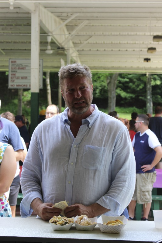 ["Every July, the Mens Club of the Steubenville, Ohio Holy Resurrection Serbian Orthodox Church hosts an annual picnic at their picnic grounds along Kings Creek in Weirton, West Virginia. The event serves as both a fundraiser for the Mens Club and a homecoming for Weirton and Steubenvilles Serbian Community. The event features Serbian music, dance, food, and drink. Mens Club members roast chickens and lambs on spits over open wood fires and sell them to picnic attendees. The spits were constructed out of material from Weirton Steel by Mens Club members and Weirton Steel employees in the 1960s. Other food served at the picnic includes pogacha (a type of Serbian bread), haluski or cabbage and noodles, cevaps (a pork, lamb, and beef sausage), strudel, nut rolls, beer, and Slivovitz.In 2017, state folklorist Emily Hilliard attended the Serbian picnic with Brynn Kusic, whose fathers family is part of the Weirton Serbian community. In 2019, Hilliard attended with a WVPB film crew to capture additional video footage and audio tape for a short video documentary (see below).Learn more about the Annual Picnic via the Holy Resurrection Serbian Orthodox Church: https://www.hrsoc-steubenville.org/annual-picnicSee the short video and audio documentary about the Chicken Blasts, produced by the West Virginia Folklife Program and West Virginia Public Broadcasting: https://wvfolklife.org/2020/01/27/weirtons-serbian-heritage-is-a-chicken-blast/ https://www.youtube.com/watch?v=XpGF-MFUlhYhttps://soundcloud.com/wvpublicnews/weirtons-serbian-heritage-is-a-chicken-blast"]%