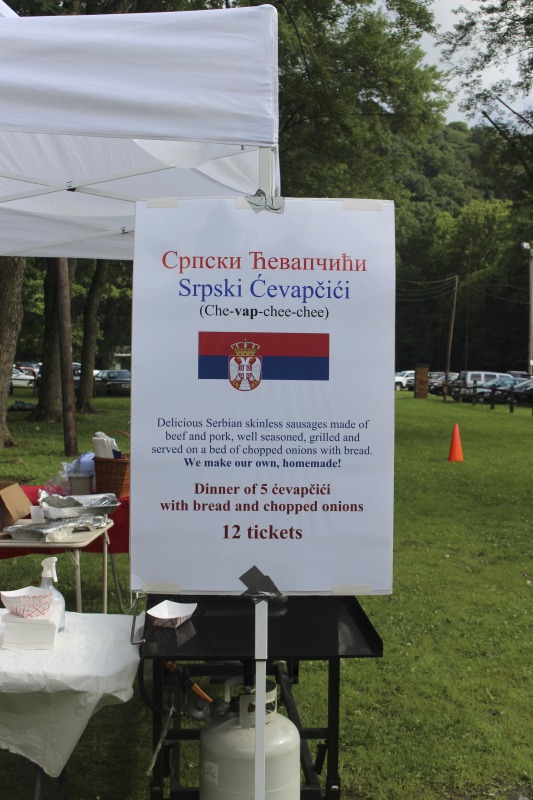 ["Every July, the Mens Club of the Steubenville, Ohio Holy Resurrection Serbian Orthodox Church hosts an annual picnic at their picnic grounds along Kings Creek in Weirton, West Virginia. The event serves as both a fundraiser for the Mens Club and a homecoming for Weirton and Steubenvilles Serbian Community. The event features Serbian music, dance, food, and drink. Mens Club members roast chickens and lambs on spits over open wood fires and sell them to picnic attendees. The spits were constructed out of material from Weirton Steel by Mens Club members and Weirton Steel employees in the 1960s. Other food served at the picnic includes pogacha (a type of Serbian bread), haluski or cabbage and noodles, cevaps (a pork, lamb, and beef sausage), strudel, nut rolls, beer, and Slivovitz.In 2017, state folklorist Emily Hilliard attended the Serbian picnic with Brynn Kusic, whose fathers family is part of the Weirton Serbian community. Learn more about the Annual Picnic via the Holy Resurrection Serbian Orthodox Church: https://www.hrsoc-steubenville.org/annual-picnicSee the short video and audio documentary about the Chicken Blasts, produced by the West Virginia Folklife Program and West Virginia Public Broadcasting: https://wvfolklife.org/2020/01/27/weirtons-serbian-heritage-is-a-chicken-blast/https://www.youtube.com/watch?v=XpGF-MFUlhYhttps://soundcloud.com/wvpublicnews/weirtons-serbian-heritage-is-a-chicken-blast"]%