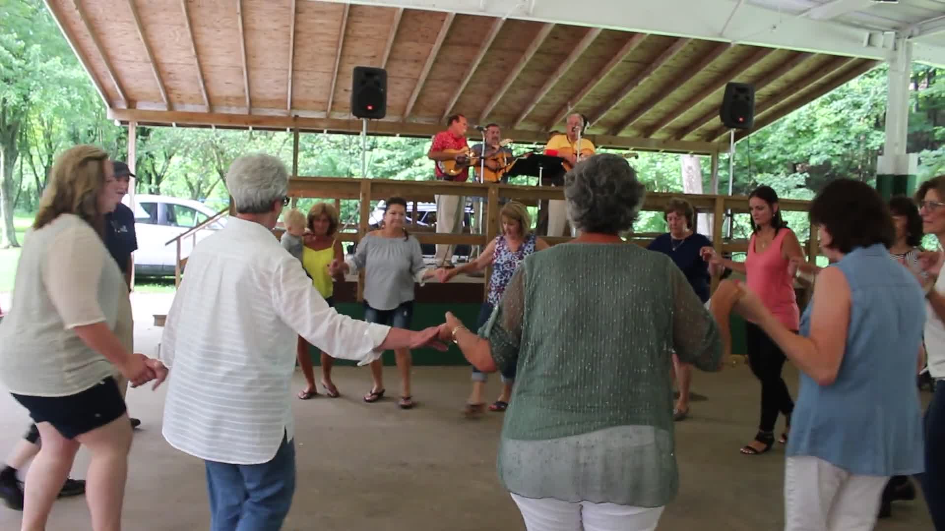 ["Every July, the Mens Club of the Steubenville, Ohio Holy Resurrection Serbian Orthodox Church hosts an annual picnic at their picnic grounds along Kings Creek in Weirton, West Virginia. The event serves as both a fundraiser for the Mens Club and a homecoming for Weirton and Steubenvilles Serbian Community. The event features Serbian music, dance, food, and drink. Mens Club members roast chickens and lambs on spits over open wood fires and sell them to picnic attendees. The spits were constructed out of material from Weirton Steel by Mens Club members and Weirton Steel employees in the 1960s. Other food served at the picnic includes pogacha (a type of Serbian bread), haluski or cabbage and noodles, cevaps (a pork, lamb, and beef sausage), strudel, nut rolls, beer, and Slivovitz.In 2017, state folklorist Emily Hilliard attended the Serbian picnic with Brynn Kusic, whose fathers family is part of the Weirton Serbian community. Learn more about the Annual Picnic via the Holy Resurrection Serbian Orthodox Church: https://www.hrsoc-steubenville.org/annual-picnicSee the short video and audio documentary about the Chicken Blasts, produced by the West Virginia Folklife Program and West Virginia Public Broadcasting: https://wvfolklife.org/2020/01/27/weirtons-serbian-heritage-is-a-chicken-blast/ https://www.youtube.com/watch?v=XpGF-MFUlhYhttps://soundcloud.com/wvpublicnews/weirtons-serbian-heritage-is-a-chicken-blast"]%