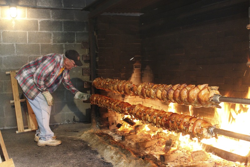 ["Every summer Wednesday since 1969, members of the Serbian Eastern Orthodox Church Mens Club have hosted a Chicken Blast at the Serbian Picnic Grounds along Kings Creek outside of Weirton, West Virginia. They roast 300-400 chickens per week as a fundraiser for the maintenance of the picnic grounds. The spits, an industrial brick oven, and walk-in coolers were constructed in the 1960s out of material from Weirton Steel by Mens Club members, most of whom were Weirton Steel employees. Each week, the choir also sells pogacha (a type of Serbian bread), haluski or cabbage and noodles, corn on the cob, strudel and other desserts. The bar at the picnic grounds is also open, serving beer and Slivovitz.See the short video and audio documentary about the Chicken Blasts, produced by the West Virginia Folklife Program and West Virginia Public Broadcasting: https://wvfolklife.org/2020/01/27/weirtons-serbian-heritage-is-a-chicken-blast/ https://www.youtube.com/watch?v=XpGF-MFUlhYhttps://soundcloud.com/wvpublicnews/weirtons-serbian-heritage-is-a-chicken-blast"]%